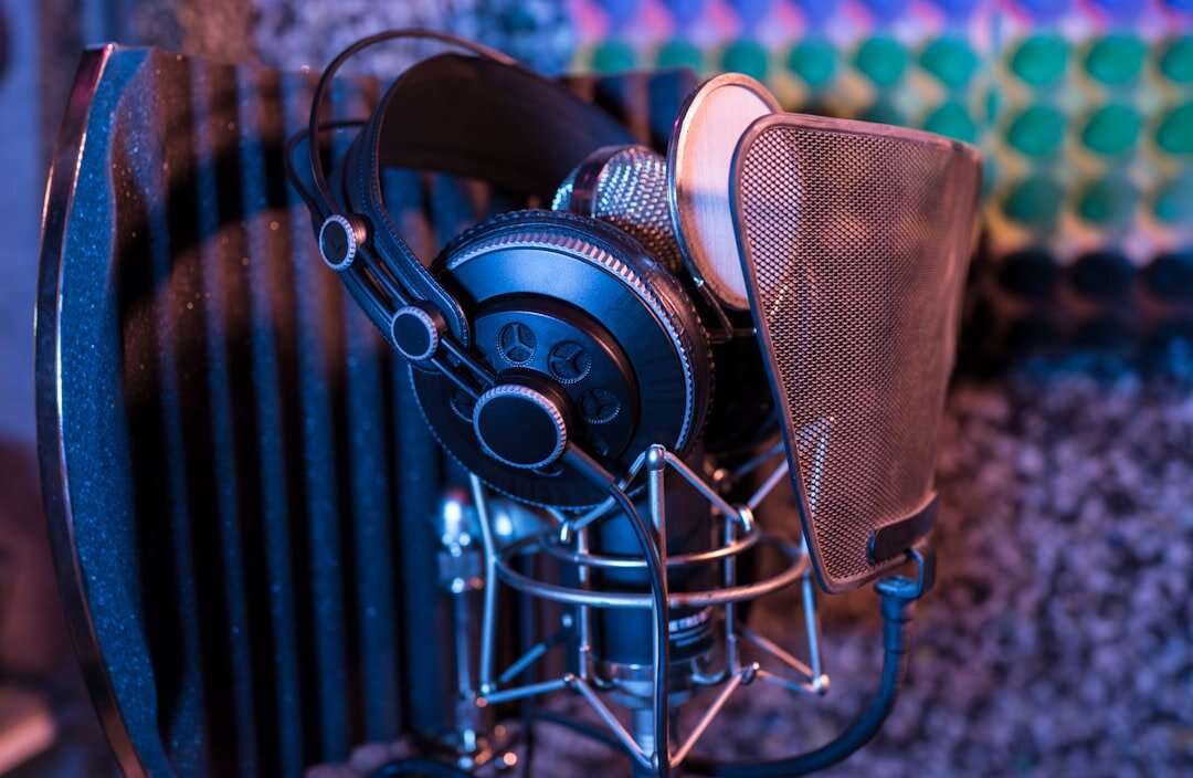 Professional podcast recording setup with large condenser microphone and headphones