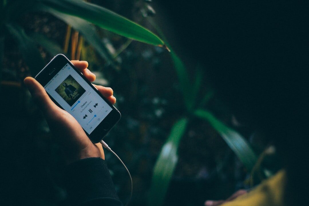 person listening to podcast on phone